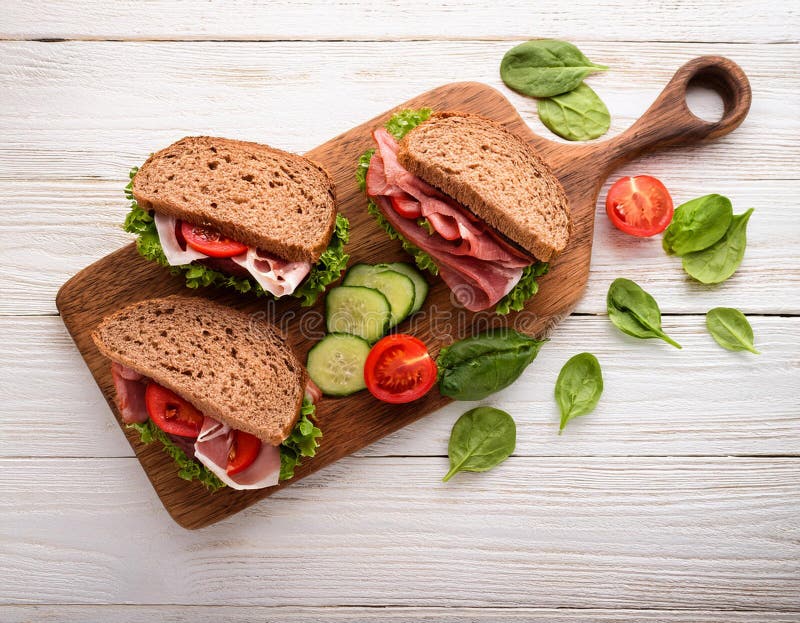 Sandwiches with beef, fresh vegetables and herbs on rustic wooden chopping board over white wood backdrop, top view. stock illustration