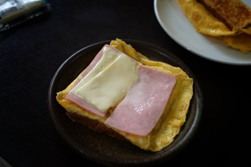 Sandwiches with Egg, Ham and Toast Cheese Fried in Dish Stock Image