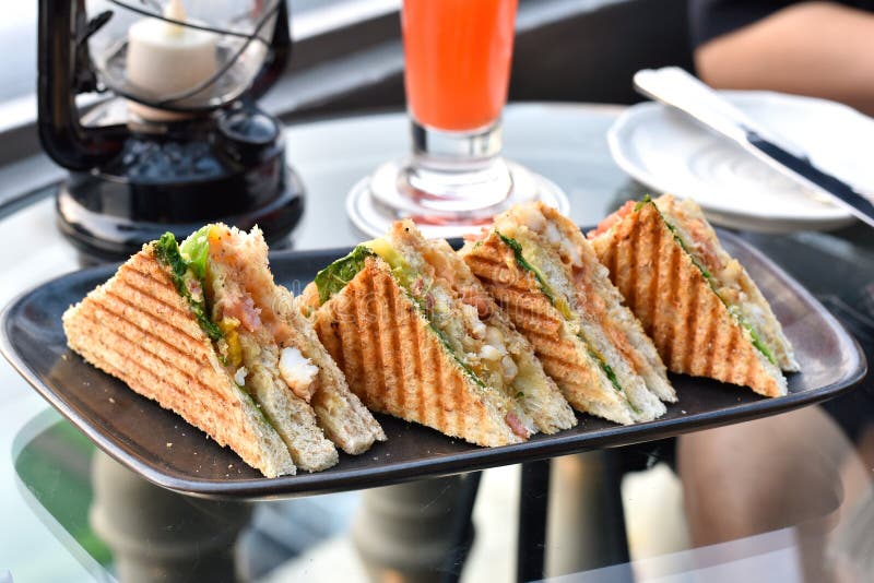 Sandwiches on plate, Grilled bread with lettuce, shrimp and egg.