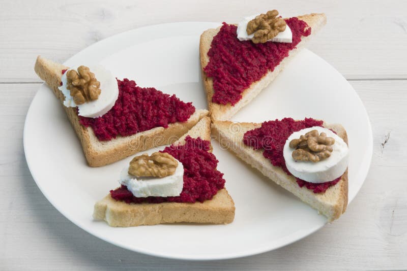 Sandwiches with Red Beet Spread, Goat Cheese and Walnut Stock Image