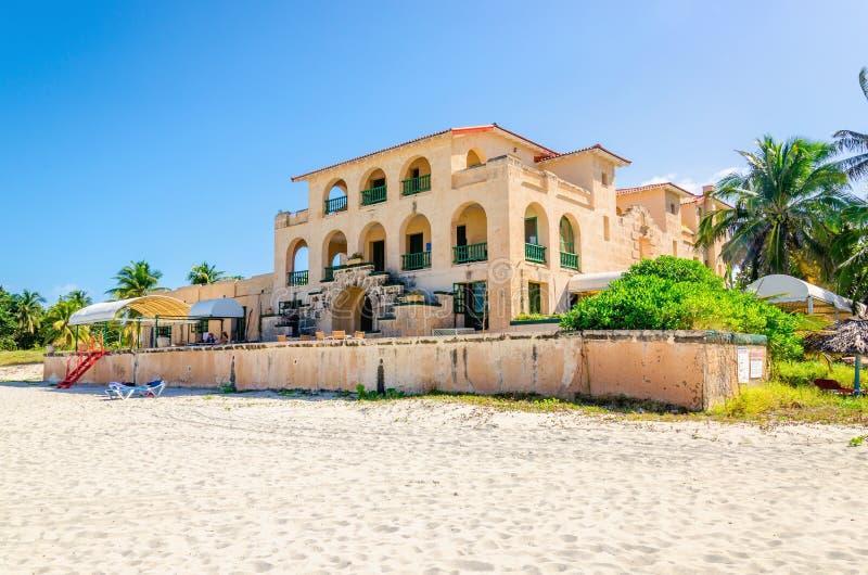 Sandy beach in Varadero with amazing old villa