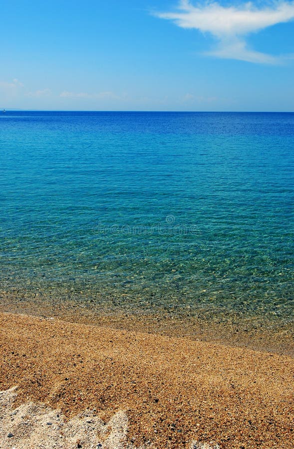 Vertical oriented picture of a sandy beach in greece. Vertical oriented picture of a sandy beach in greece