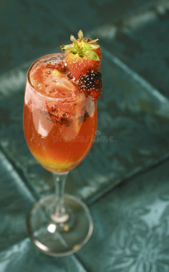 Sangria with champagne and strawberry and blackberry