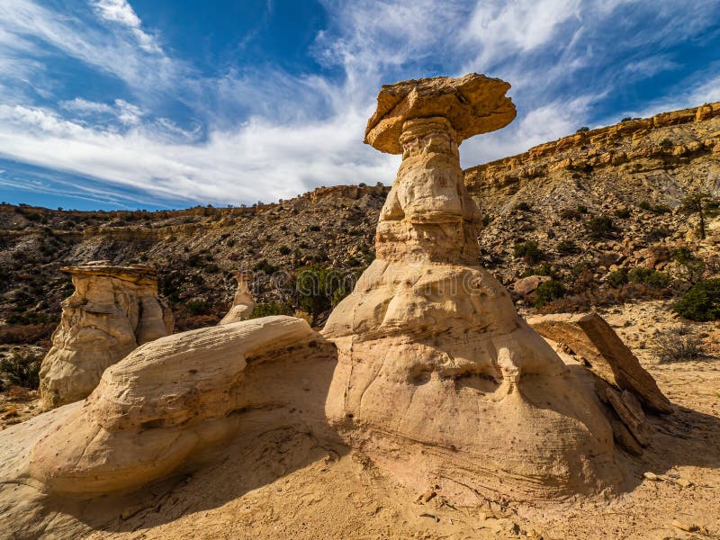 Cretateous Sandstone Hoodoo With Blue Sky And Clouds Located In The Ojito Wilderness Area, Sandoval County, New Mexico. Cretateous Sandstone Hoodoo With Blue Sky And Clouds Located In The Ojito Wilderness Area, Sandoval County, New Mexico