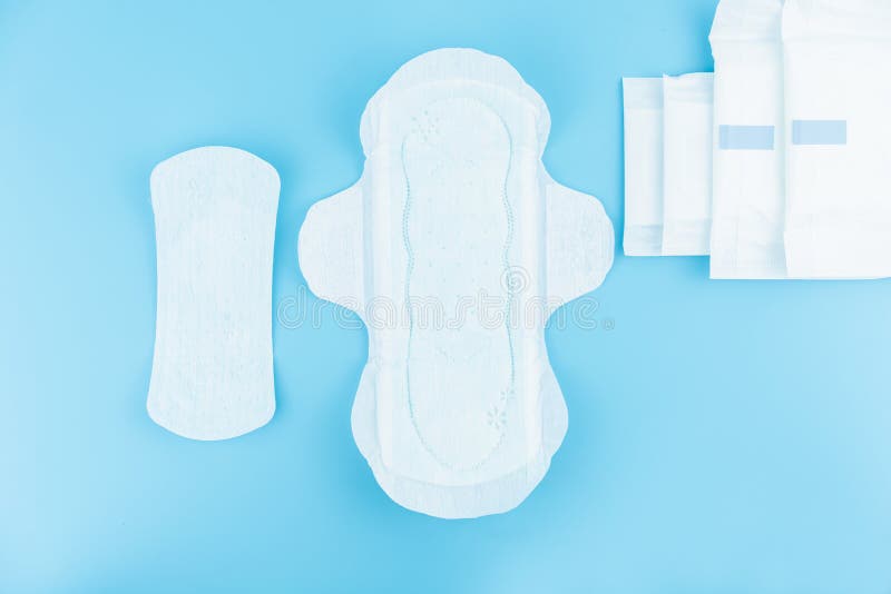 Sanitary Pads and Absorbent Sheets on a Blue Background Stock Photo