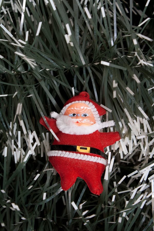 Red christmas santa on spruce background. Red christmas santa on spruce background