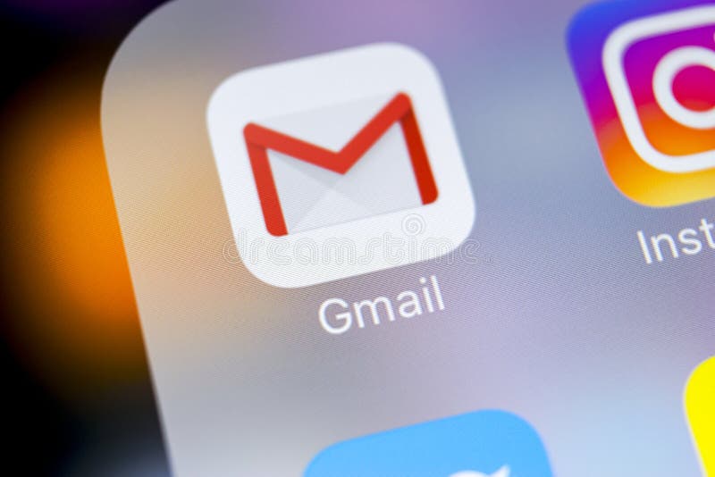 Google Gmail application icon on Apple iPhone X smartphone screen close-up. Gmail app icon. Gmail is popular Internet online e-ma stock photo