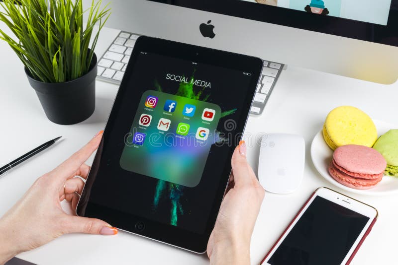 Woman Hands using iPad pro with icons of social media facebook, instagram, twitter, google application on screen. Smartphone stock photos Woman Hands using iPad pro with icons of social media facebook, instagram, twitter, google application on screen. Smartphone stock photos