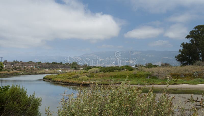 A shallow waterway near the ocean where birds and other wildlife gather, and families can enjoy outdoor time. The San Pedro creek meets the slough near the shore. A shallow waterway near the ocean where birds and other wildlife gather, and families can enjoy outdoor time. The San Pedro creek meets the slough near the shore