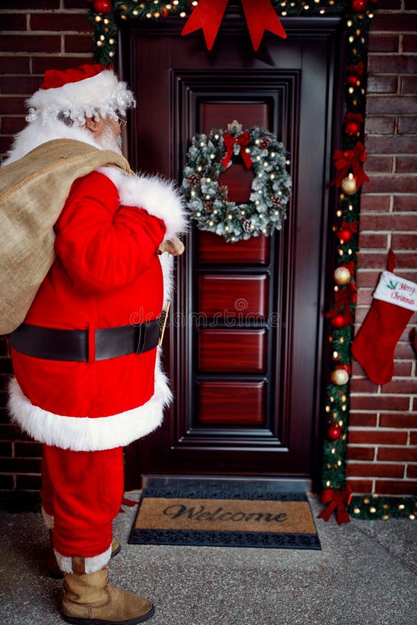Santa Claus arrives with present on large bag at in night royalty free stock images Santa Claus arrives with present on large bag at in night royalty free stock images