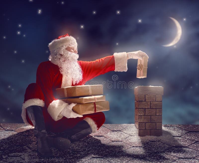 Santa Claus che si siede sul tetto