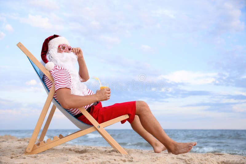 Santa Claus With Cocktail Relaxing In Chair On Beach, Space For Text ...