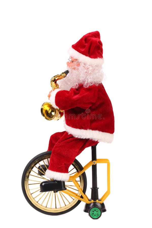 Santa Claus docka på en cykel. arkivfoto Santa Claus docka på en cykel. arkivfoto