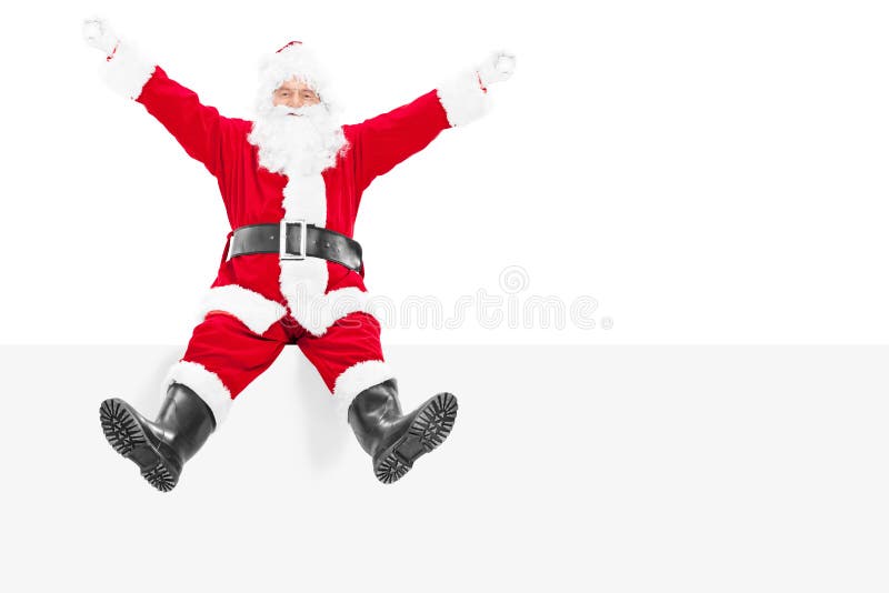 Santa Claus encantada que se sienta en un panel en blanco fotografía de archivo Santa Claus encantada que se sienta en un panel en blanco fotografía de archivo