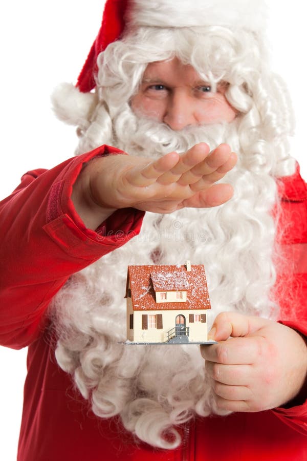 Santa Claus holding house stock image. Image of holiday 12132073