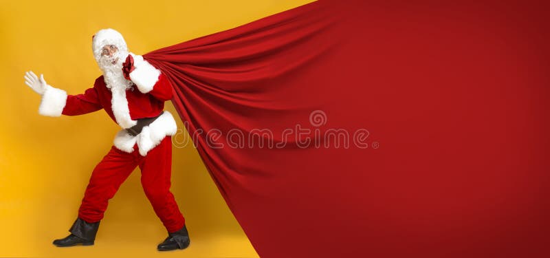 Santa Claus and huge sack with copy space for text on orange