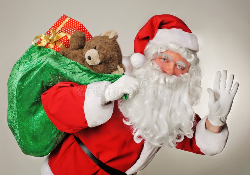 Santa Claus och gåvapåsen arkivbild Santa Claus och gåvapåsen arkivbild