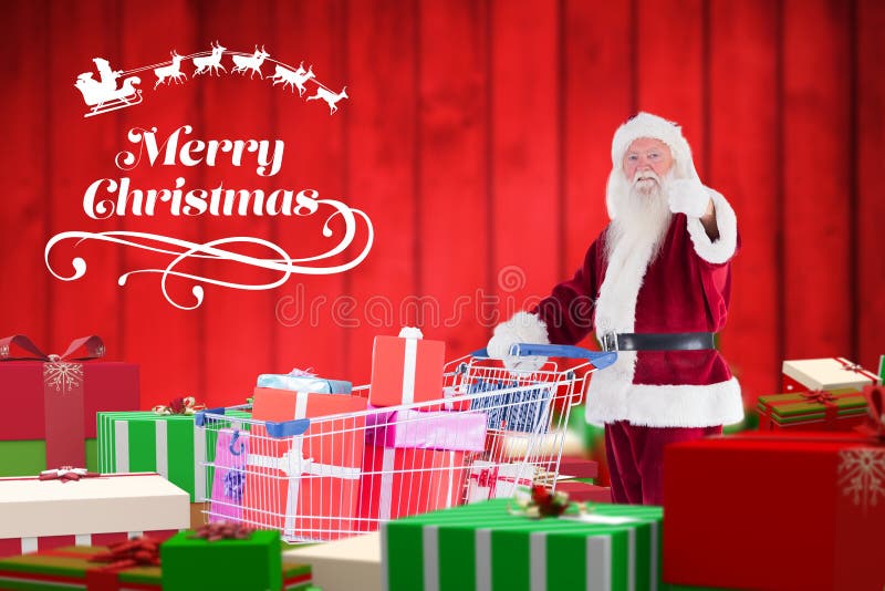 Santa Claus pokazuje aprobaty podczas gdy trzymający wózek na zakupy prezenty pełno obrazy royalty free Santa Claus pokazuje aprobaty podczas gdy trzymający wózek na zakupy prezenty pełno obrazy royalty free