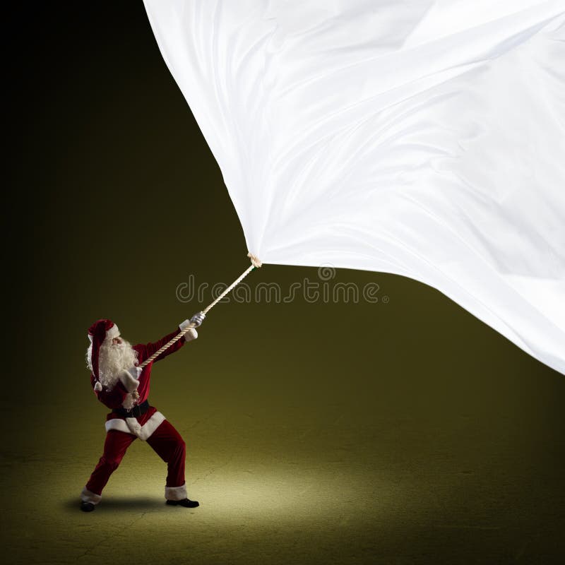 Santa Claus pulls the banner stock photography