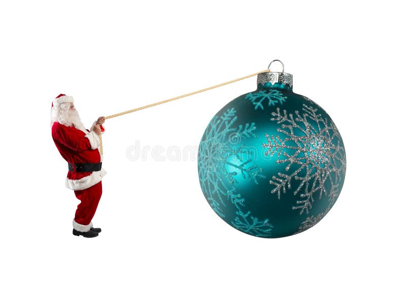 Santa claus pulls a rope to move a big christmas ball royalty free stock images