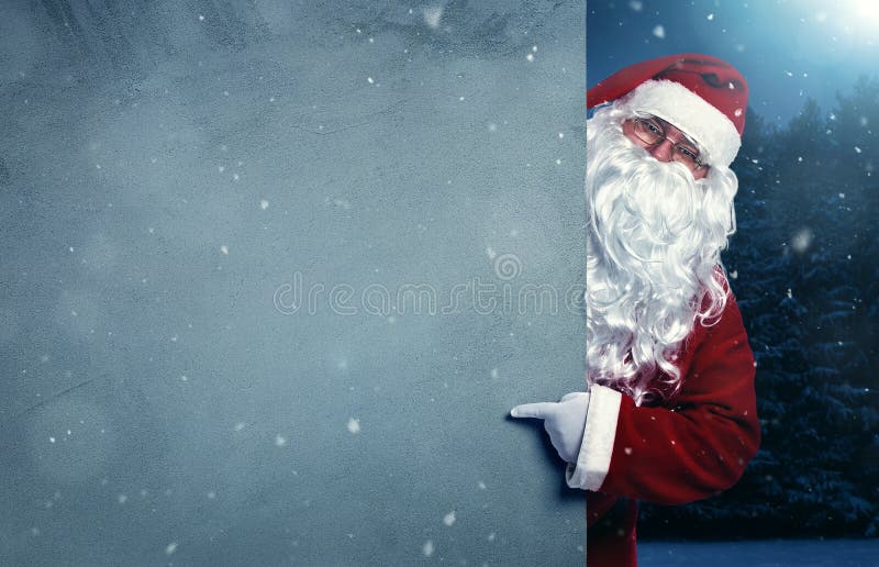 Santa Claus que aponta na bandeira imagens de stock royalty free Santa Claus que aponta na bandeira imagens de stock royalty free