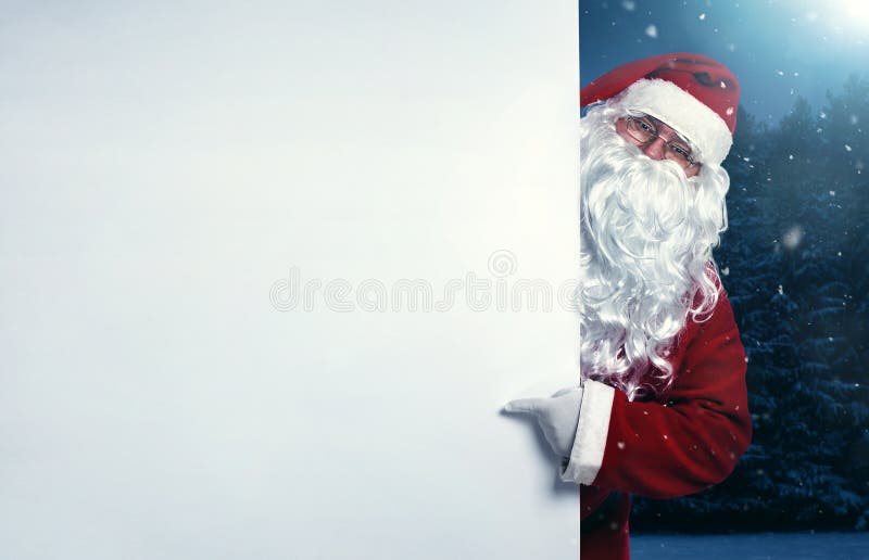 Santa Claus que aponta na bandeira fotografia de stock royalty free Santa Claus que aponta na bandeira fotografia de stock royalty free