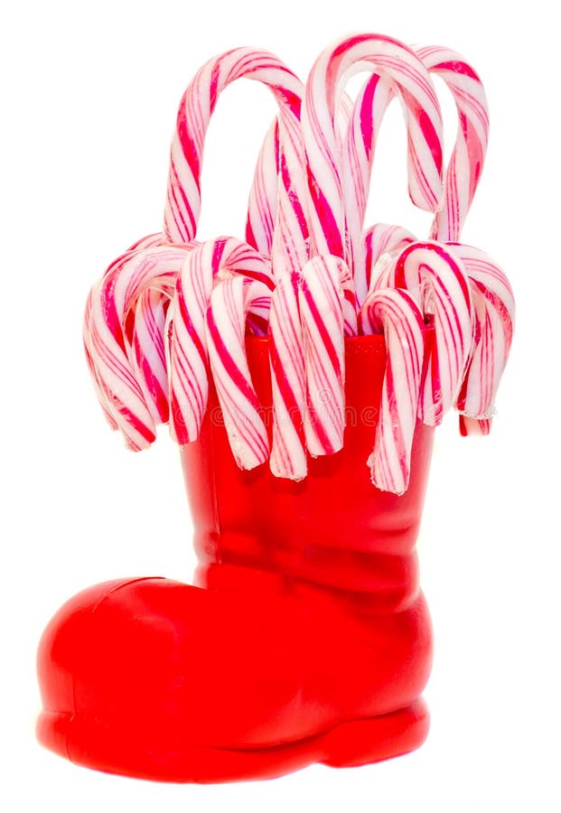 Santa Claus red boot, shoe with colored sweet lollipops, candys. Saint Nicholas boot with presents gifts.