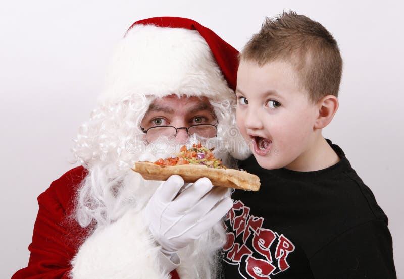 Santa claus smiling and eating pizza