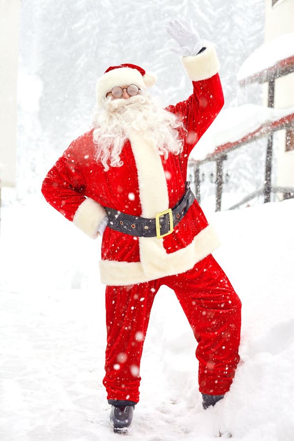 Santa Claus on snow in winter at Christmas