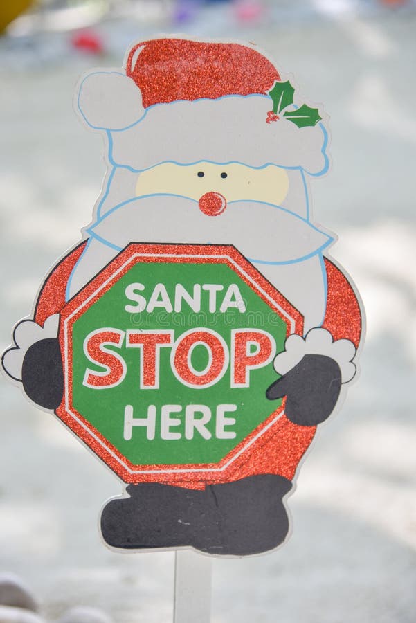 Santa claus stop here christmas paper sign