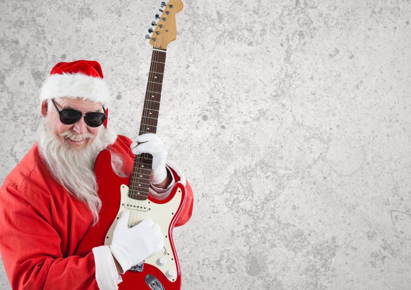 Santa claus wearing sunglasses playing guitar stock photo Santa claus wearing sunglasses playing guitar stock photo