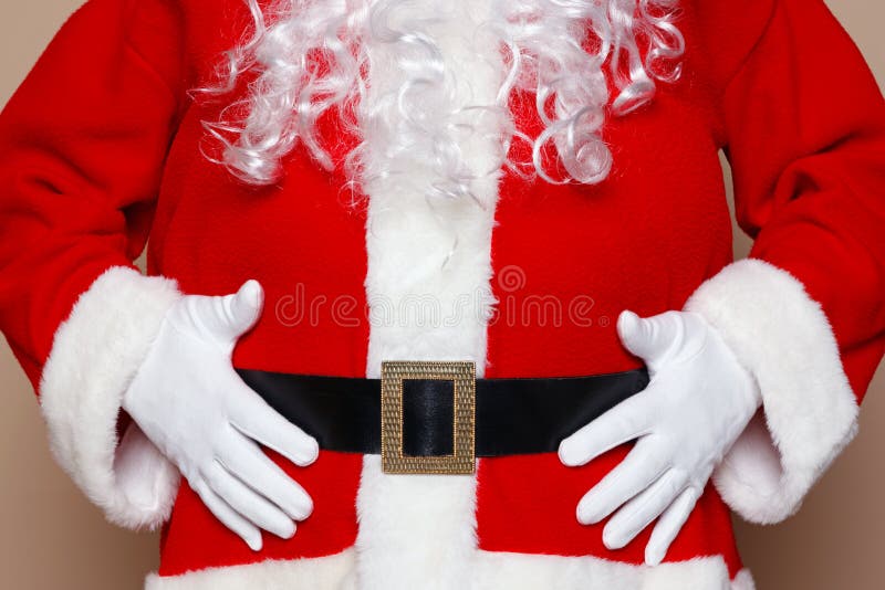 Santa Claus держа его живот стоковые фотографии rf Santa Claus держа его живот стоковые фотографии rf