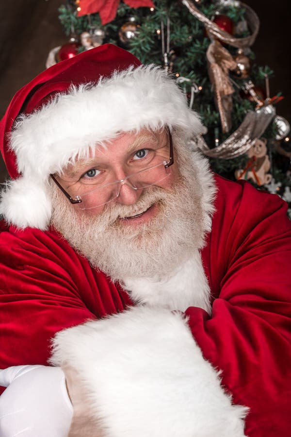 Santa Clause Gives Stocking To Elf Stock Photo - Image of gives, clause ...
