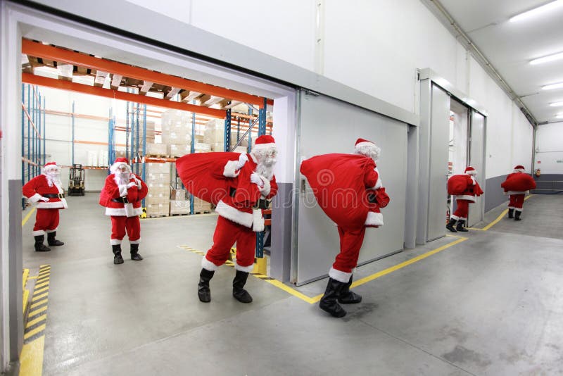 Santa clauses leaving a gift distribution center