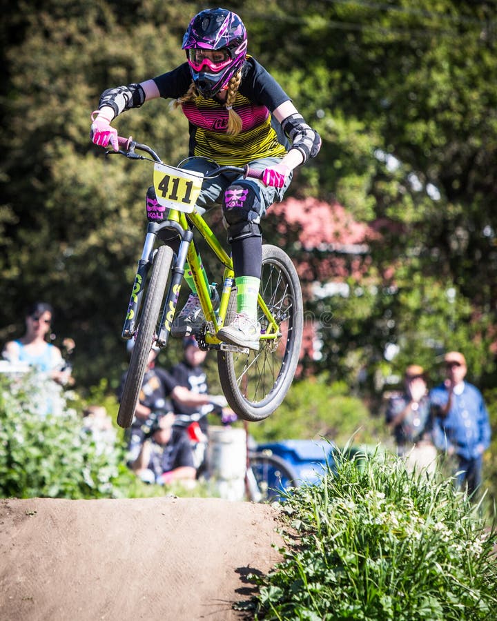 Female competition at the Post Office jumps during the 2014 Santa Cruz Mountain Bike Festival in Aptos, CA. Female competition at the Post Office jumps during the 2014 Santa Cruz Mountain Bike Festival in Aptos, CA.