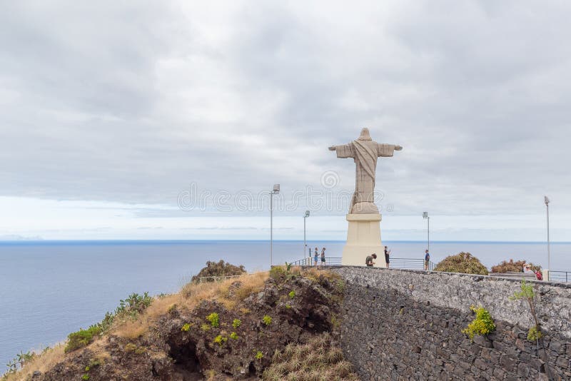 SANTA-CRUZ, PORTUGAL - JULY 29, 2018: Statue of Christ in Madeira on the cliff of Cape Garageu near the village of Santa