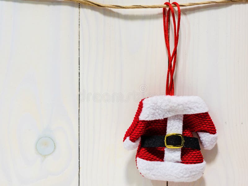 Santa dress hanging on wooden background stock photography Santa dress hanging on wooden background stock photography
