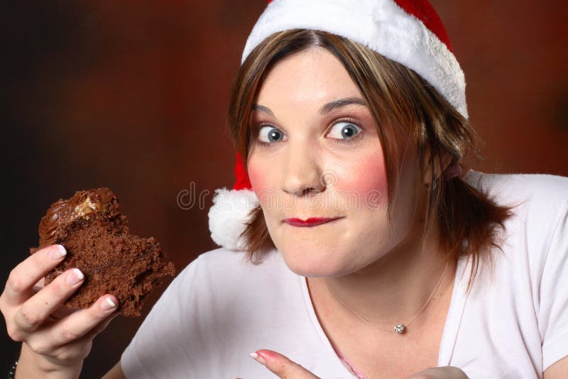 Santa girl with cake royalty free stock photography Santa girl with cake royalty free stock photography