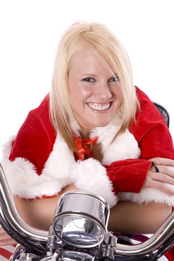 Santa helper leaning on motorcycle