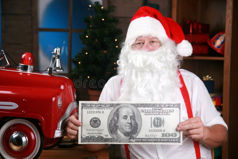 Santa holds a giant one hundred dollar bill