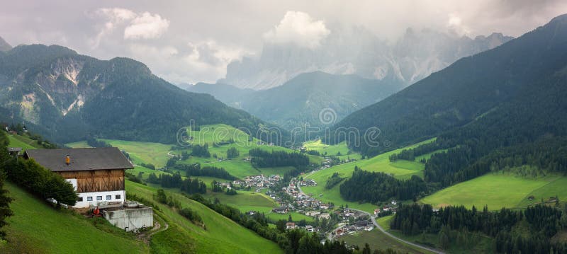 Santa Maddalena village and church with Dolomites mountains on background, Italy