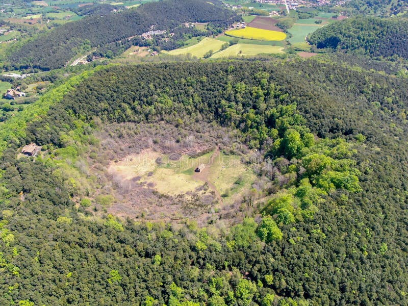 The Santa Margarida Volcano is an extinct volcano in the comarca of Garrotxa, Catalonia, Spain. The volcano has a perimeter of 2 km and a height of 682 meters in Garrotxa Volcanic Zone Natural Park. The Santa Margarida Volcano is an extinct volcano in the comarca of Garrotxa, Catalonia, Spain. The volcano has a perimeter of 2 km and a height of 682 meters in Garrotxa Volcanic Zone Natural Park