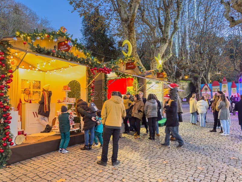 Santa Maria da Feira, Portugal - december 2 2023. Families shopping Christmas presents at traditional Xmas Perlim street market in Santa Maria da Feira, Portugal. Santa Maria da Feira, Portugal - december 2 2023. Families shopping Christmas presents at traditional Xmas Perlim street market in Santa Maria da Feira, Portugal