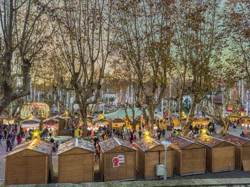 Santa Maria da Feira, Portugal - december 2 2023. Families shopping Christmas presents at traditional Xmas Perlim street market in Santa Maria da Feira, Portugal. Santa Maria da Feira, Portugal - december 2 2023. Families shopping Christmas presents at traditional Xmas Perlim street market in Santa Maria da Feira, Portugal