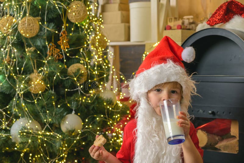 Santa picking cookie. Cookies for Santa Claus child. Christmas cookies and milk. Merry Christmas. Greeting card stock photo Santa picking cookie. Cookies for Santa Claus child. Christmas cookies and milk. Merry Christmas. Greeting card stock photo