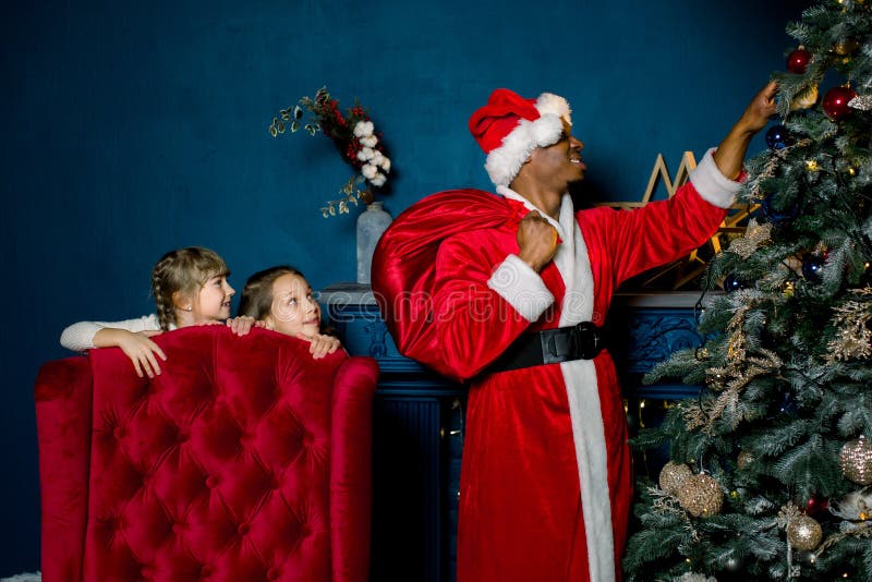 Premium Photo  Mom and son sort out santa's gifts under the