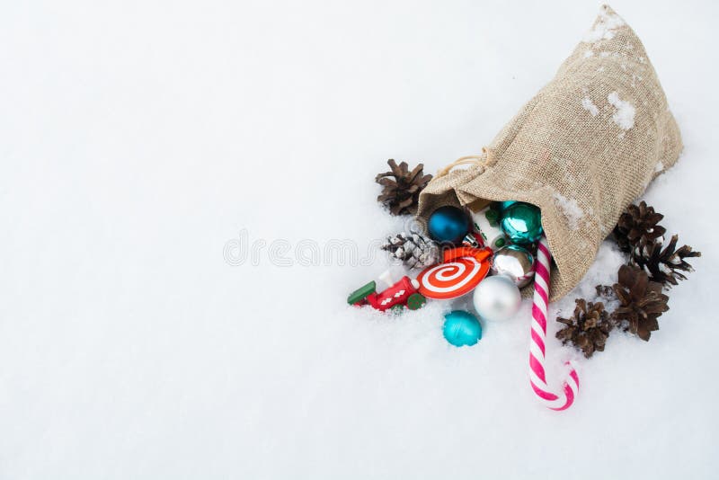 Santa`s gift bag full of Christmas toys and gifts on the snow royalty free stock photos Santa`s gift bag full of Christmas toys and gifts on the snow royalty free stock photos