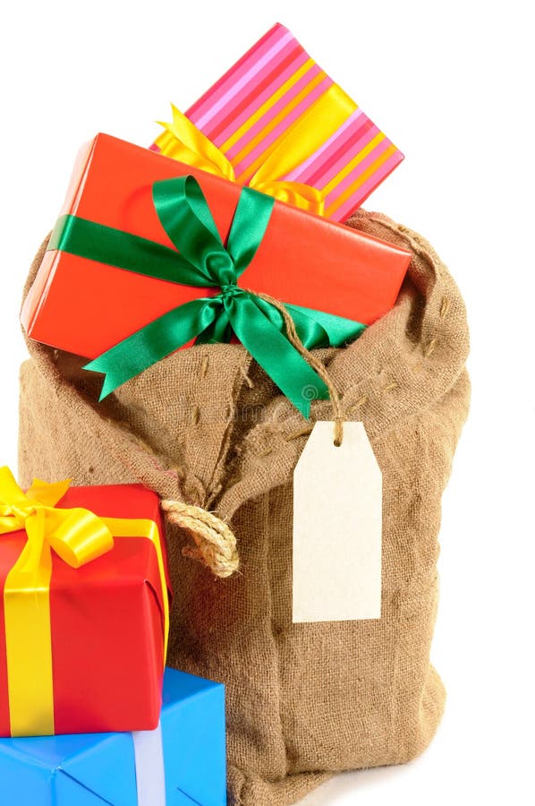 Santa sack or mail bag full with pile of Christmas gifts isolated on white background. Santa sack full with pile of Christmas gifts isolated on white background royalty free stock photography Santa sack or mail bag full with pile of Christmas gifts isolated on white background. Santa sack full with pile of Christmas gifts isolated on white background royalty free stock photography