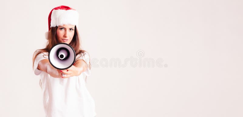 Santa woman screaming by megaphone stock image