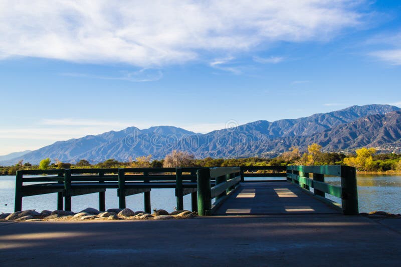 This is the dock at the Sante Fe Dam Recreational Area outside of downtown Los Angeles, California. The beautifully secluded park in the San Gabriel Valley surrounds a 70-acre lake, great for fishing and water sports year round, with an excellent view of the San Gabriel Mountains. This is the dock at the Sante Fe Dam Recreational Area outside of downtown Los Angeles, California. The beautifully secluded park in the San Gabriel Valley surrounds a 70-acre lake, great for fishing and water sports year round, with an excellent view of the San Gabriel Mountains.